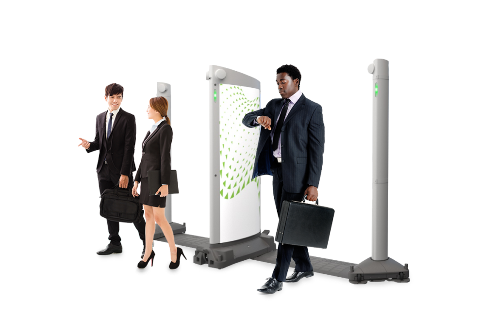 A group of several people walking through an Evolv Express security device.