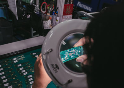 Columbia Tech test technician performs a final inspection of PCB assembly