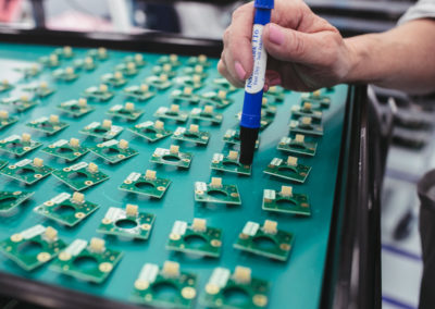 An inspector stamps each board with their unique stamp for verification