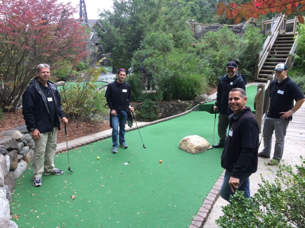 columbia tech employees playing mini golf