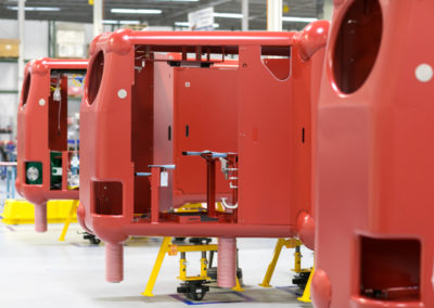 A large, red, semiconductor assembly in one of Columbia Tech's flexible production cells.